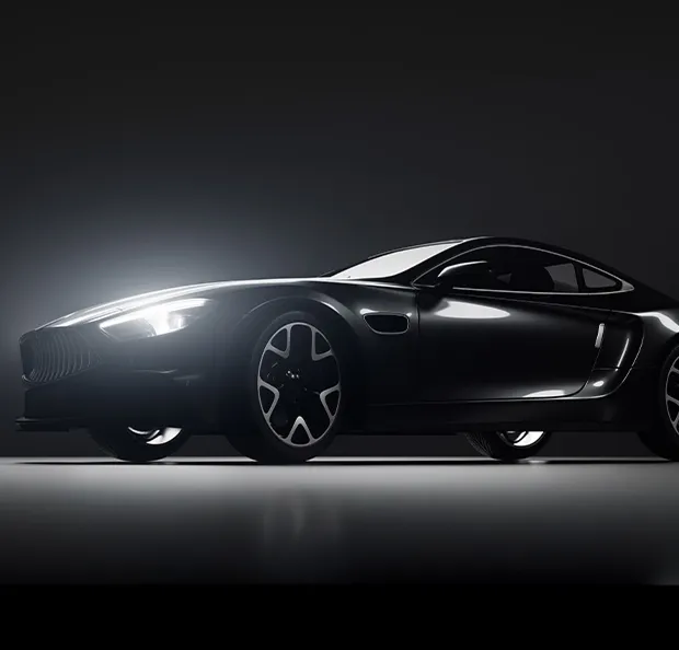 Voiture de sport noire élégante éclairée de profil dans un studio sombre et minimaliste à Poissy dans les Yvelines 78