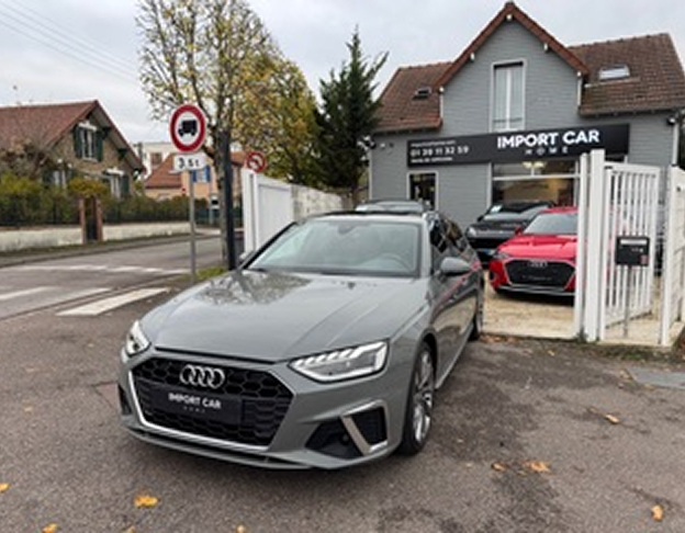 Berline Audi grise garée devant le showroom Import Car Home en zone résidentielle à Poissy dans les Yvelines 78